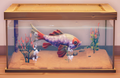 An in-game look at Giant Goldfish in a fish tank.